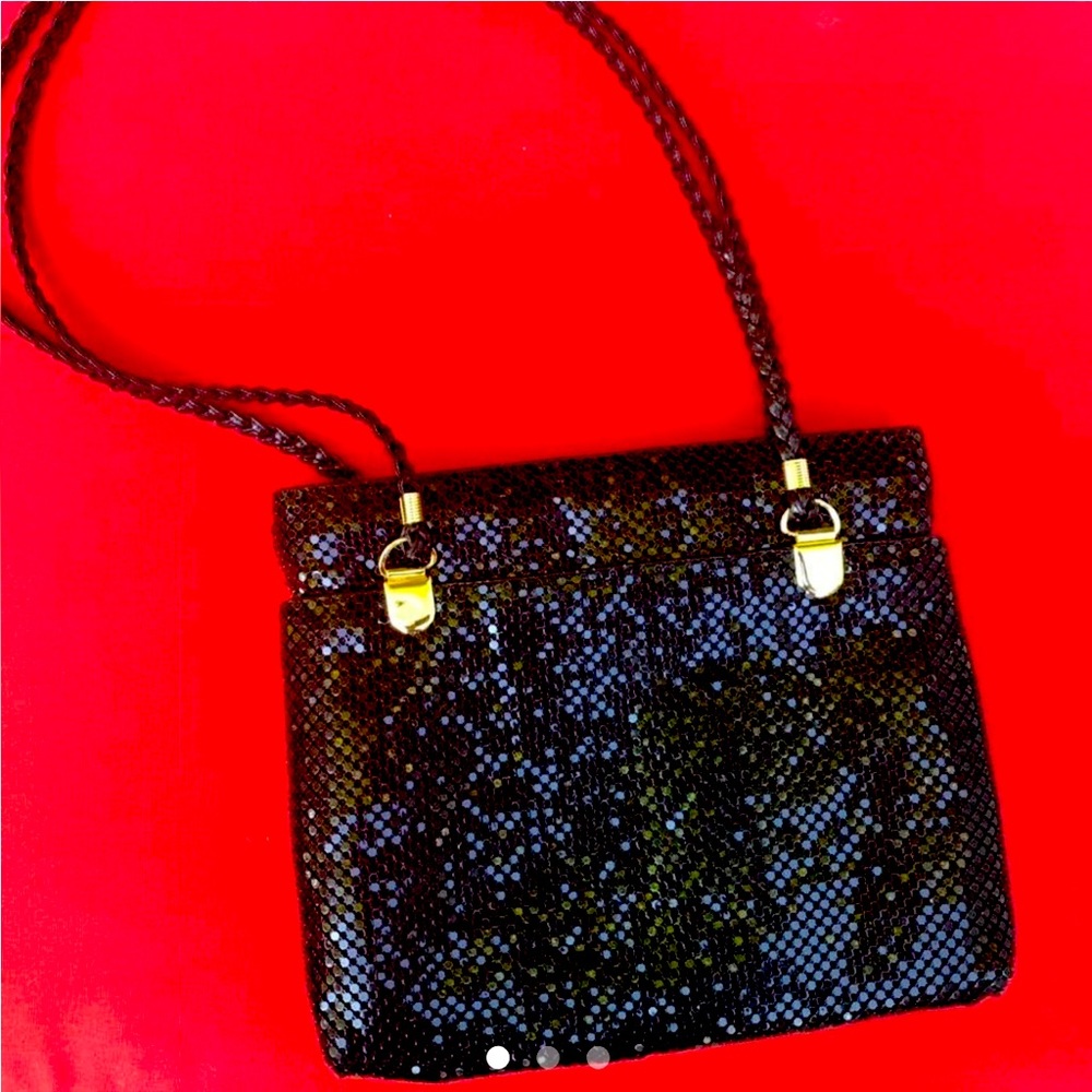 Shiny Black mini octagon with golden cuffs and braided handle straps bag